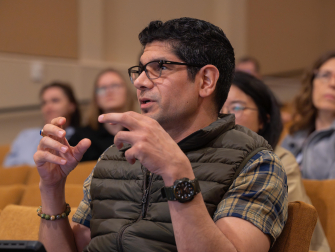 A member of the audience asks a question during Frontiers in Science.